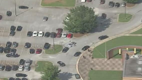 Two men in custody after officer-involved shooting at Lithonia High School