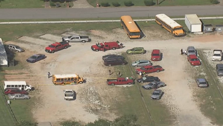 Fairburn police investigate a deadly accident involving a school bus at Landmark Christian School on Aug. 27, 2021.