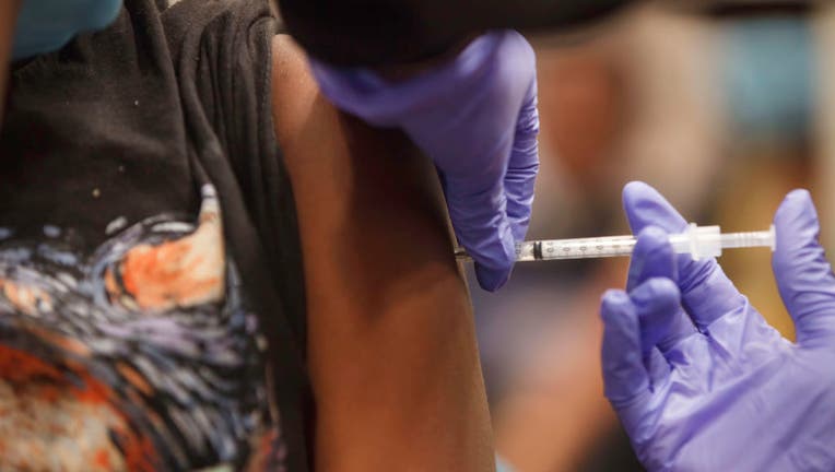 Anyla Wade-Bacon, 13, of Columbus, Ohio receives the vaccine