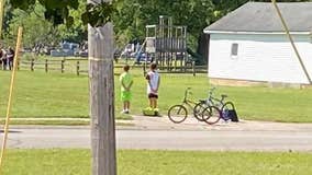 Boys hop off their bikes, pay respects during military veteran's funeral