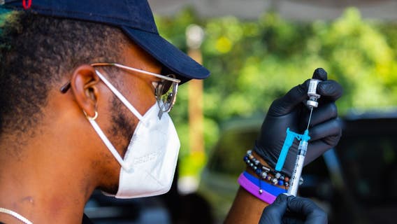 Georgians begin lining up for COVID-19 booster shots, but many remain unvaccinated