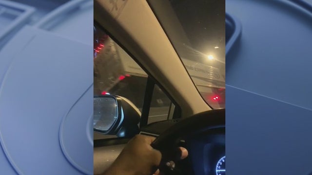 Video captures tractor-trailer leaning on I-285 median