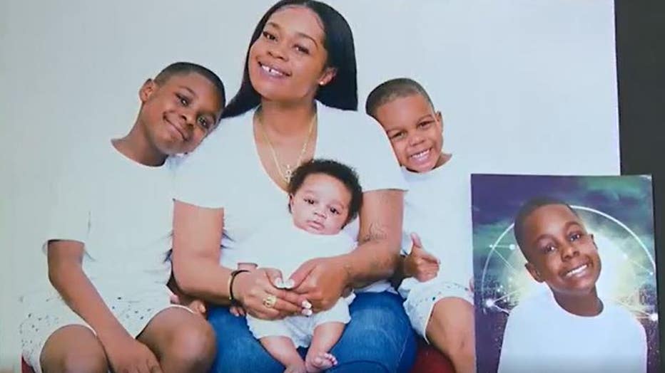 Nakeda Martina pictured with her children. Her 12-year-old son, Andre, was killed by his grandfather, according to police.