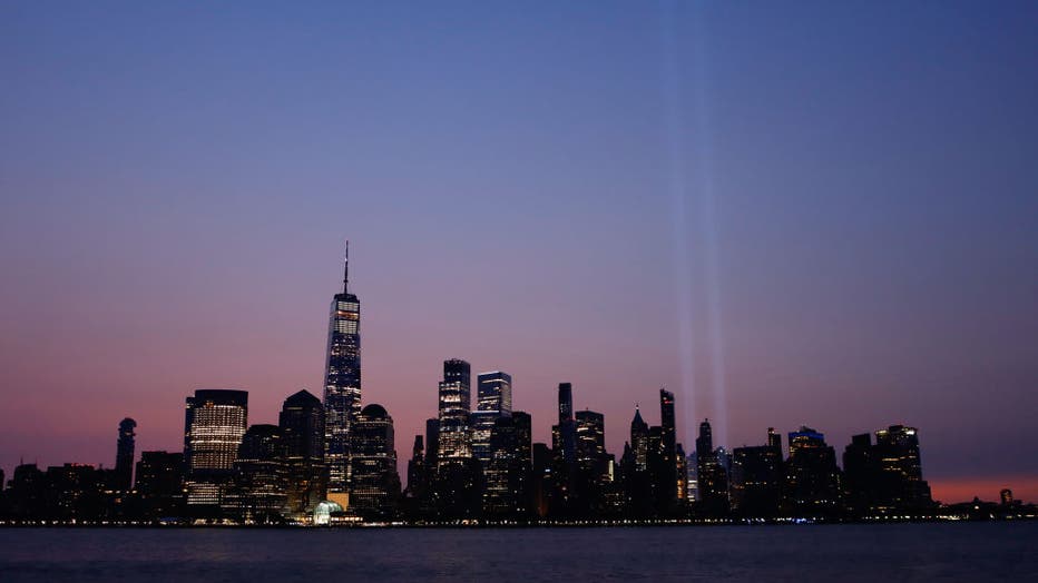 Tribute in Light Fades as the Sun Rises in New York City