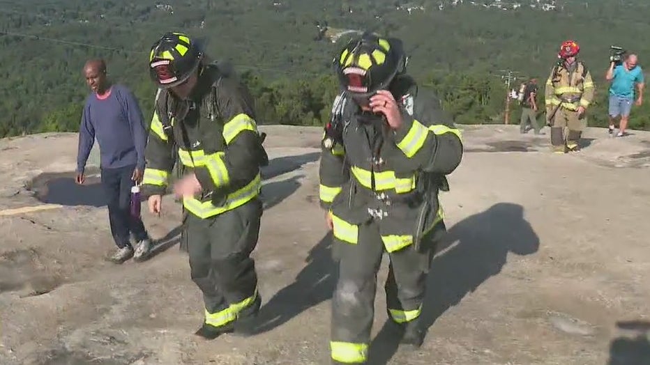 firefighters climb stone mountain