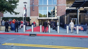 Fans cheer for Braves players and families at Truist Park as the team travels to Los Angeles