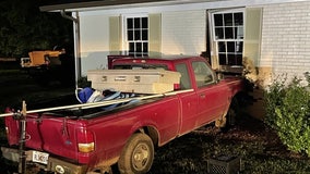 Coweta County teenager narrowly escapes injury when truck plows into home