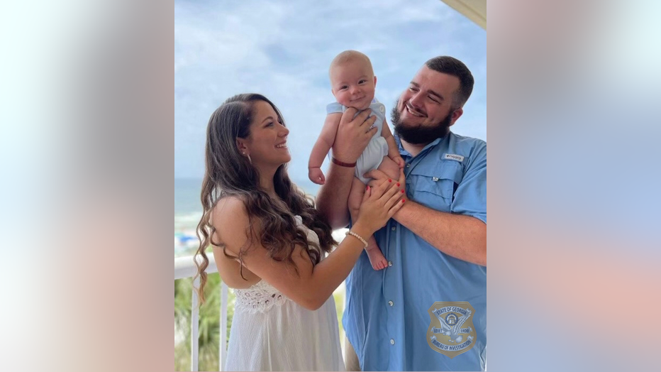 Officer Dylan Harrison is seen her with his wife and his young infant in a recent family photo provided by the GBI.