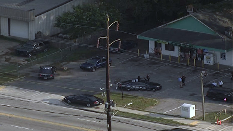Police investigate after a shooting in the parking lot of a store along Glenwood Avenue on Oct. 14, 2021.