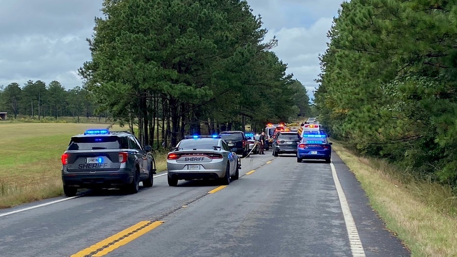 State and local law enforcement investigate a deadly crash along Highway 18 near E. Drummond Road on Oct. 5, 2021.