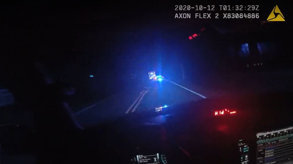 Bodycam from a Coweta County deputy shows the driver of a U-Haul truck driving in the wrong lane without its lights on along US-27 on Oct. 11, 2020.