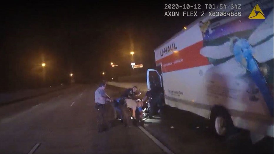 Bodycam from a Coweta County deputy shows deputies pulling the injured driver from a U-Haul after a high-speed chase along I-85 on Oct. 11, 2020.