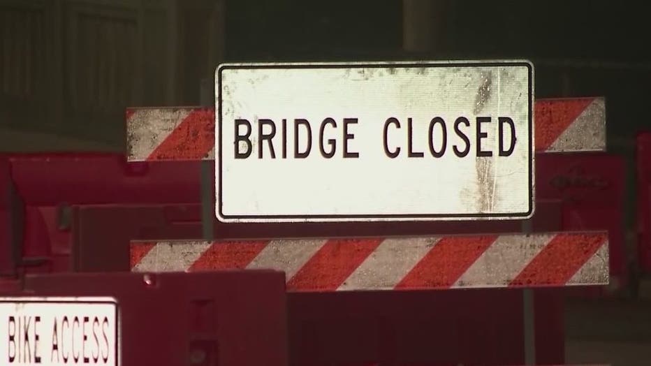 A "bridge closed" sign now blocks traffic along Cheshire Bridge Road after a fire crippled the infrastructure.