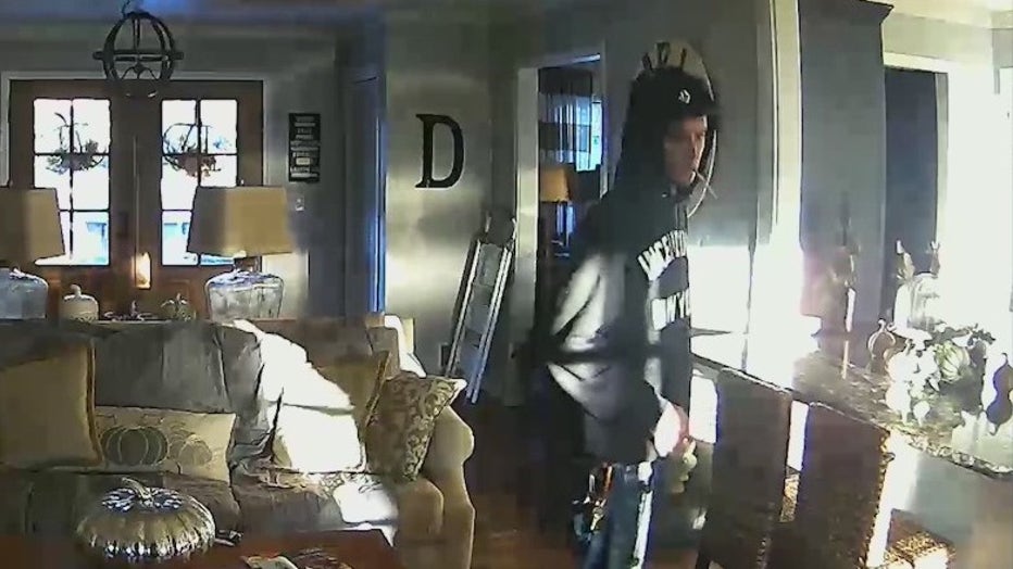 A man is caught by home surveillance walking around a Marietta family's home.