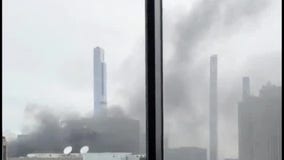 Smoke billowing from roof of Midtown high-rise under construction