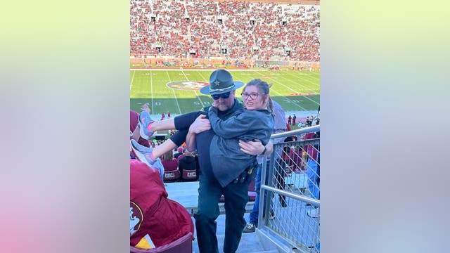 Florida deputy carries girl who was struggling to walk to her seat at FSU football game, sheriff's office says