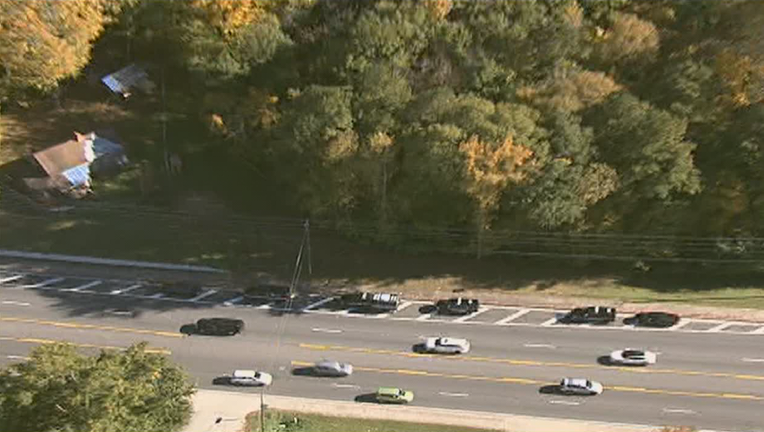 Police search for clues after human remains were found behind a DeKalb County church on Nov. 12, 2021.