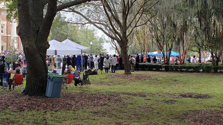 Hundreds gather outside the Glynn County courthouse in response to a defense lawyer’s bid to keep Black ministers out of the courtroom on Nov. 18, 2021.