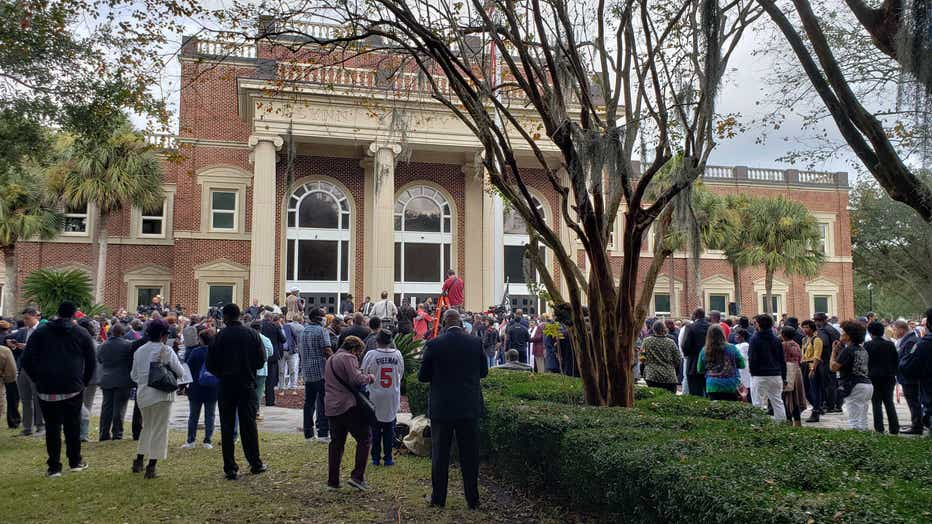 Hundreds gather outside the Glynn County courthouse in response to a defense lawyer’s bid to keep Black ministers out of the courtroom on Nov. 18, 2021.