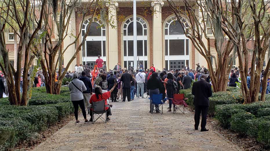 Hundreds gather outside the Glynn County courthouse in response to a defense lawyer’s bid to keep Black ministers out of the courtroom on Nov. 18, 2021.