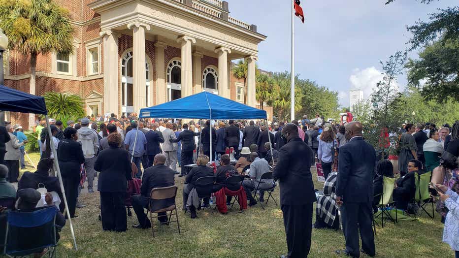Hundreds gather outside the Glynn County courthouse in response to a defense lawyer’s bid to keep Black ministers out of the courtroom on Nov. 18, 2021.