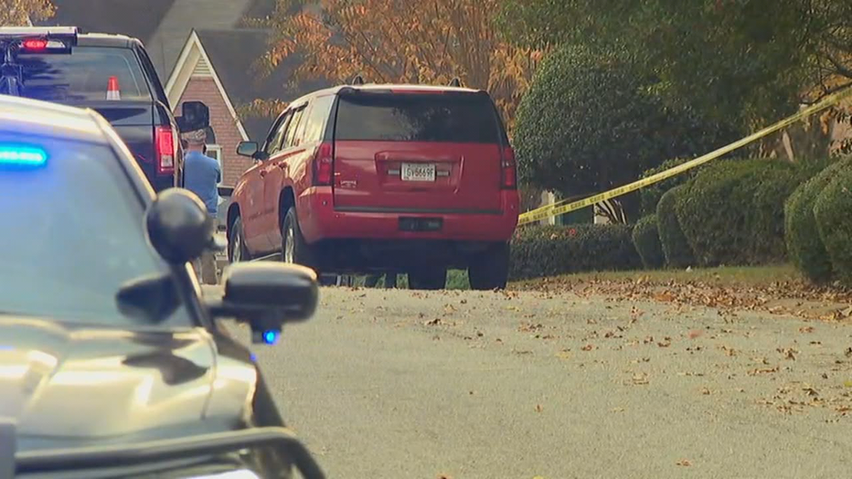 Police investigate a deadly double shooting at a home near Acworth on Nov. 18, 2021.