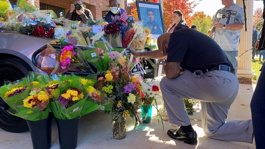 One by one, Officer Desai’s colleagues, family, and members of the public lay flowers on his cruiser. Henry County Police Officer Paramhans Desai was 38 years old (Rob DiRienzo/FOX 5 Atlanta).