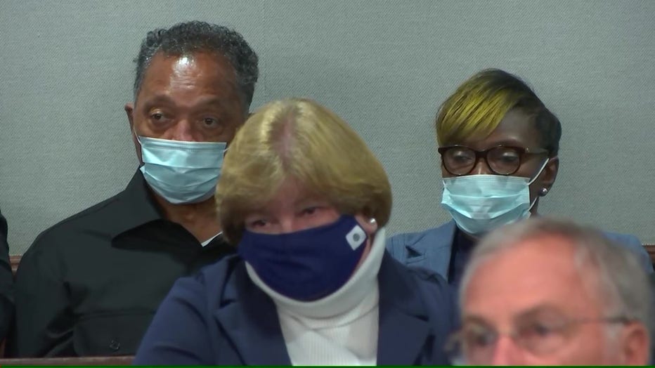 Reb. Jesse Jackson sit with the family of Ahmaud Arbery during the trial of the three men accused in his death in a Glynn County courtroom on Nov. 18, 2021.