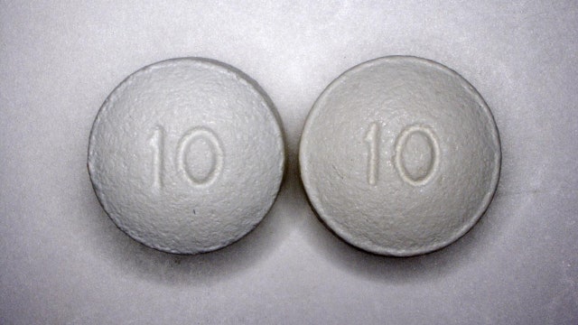 Lawsuits against OxyContin owners on hold; judge orders negotiations