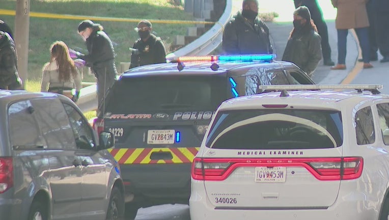 Police investigate after a body was found near the I-20 onramp at Pryor Street in Atlanta on Dec. 23, 2021.