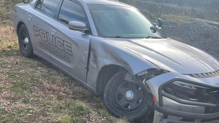 Commerce police share a photo of one of their cruisers that was sideswiped while on a call along I-85 on Dec. 20, 2021.