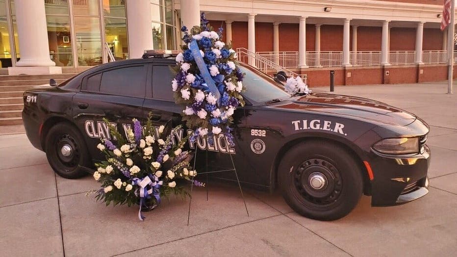 The Clayton County Police Department has parked Officer Henry Laxson's patrol car in front of their headquarters as a memorial to the fallen officers.