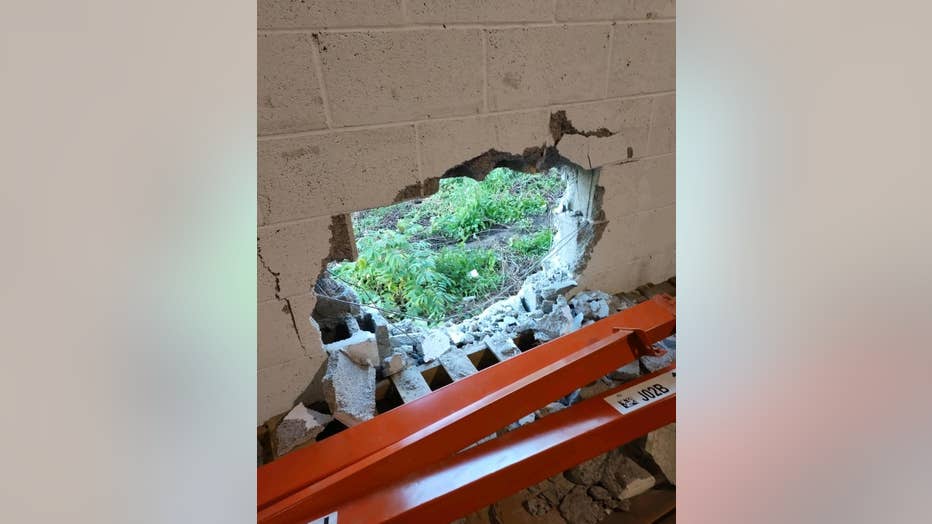 The Empty Stocking Fund shared this photo on their Facebook page showing the hole smashed into their warehouse wall after a break-in on Dec. 22, 2021.