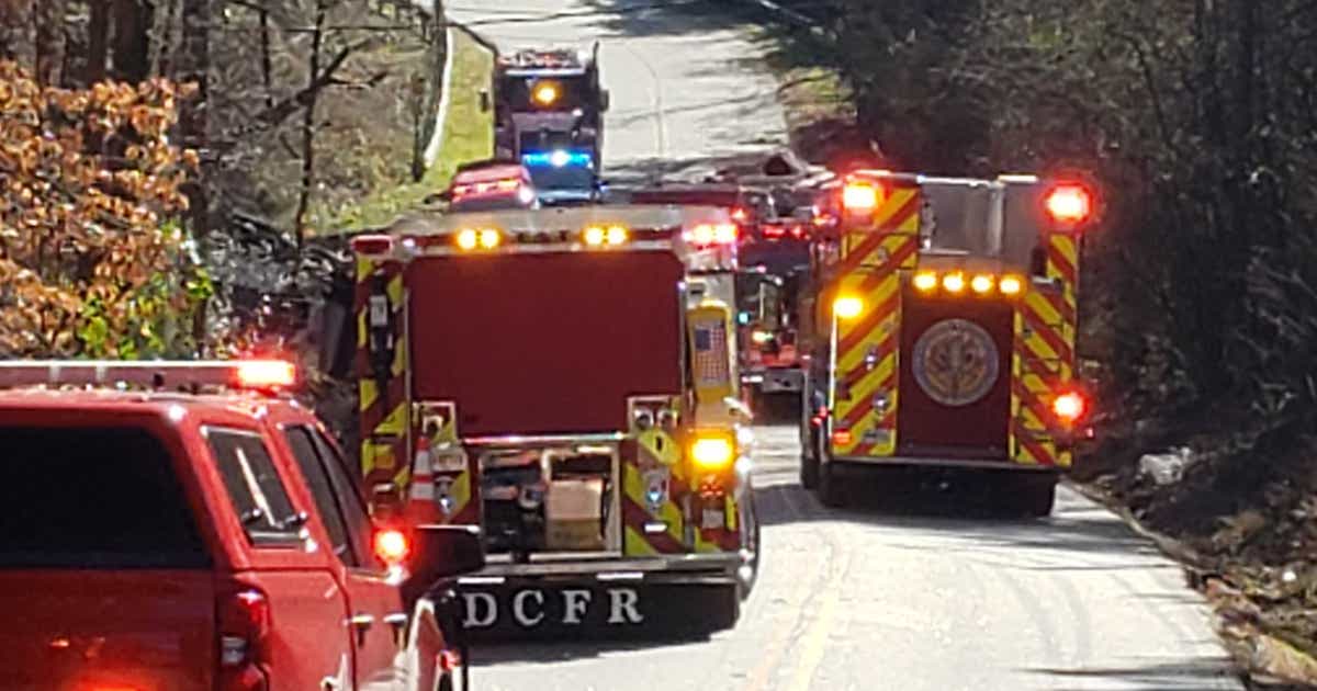 Fire crews rescue woman trapped in car pinned under dump truck | FOX 5 ...