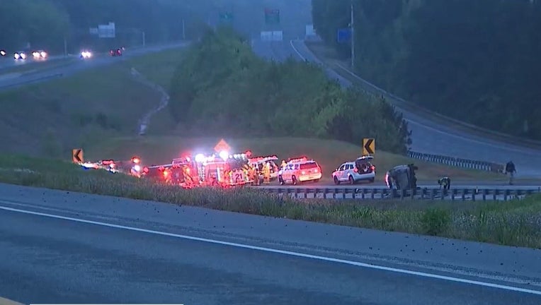 Gwinnett County police investigate a fiery crash that killed six people along I-85 near I-985 in April 2021.