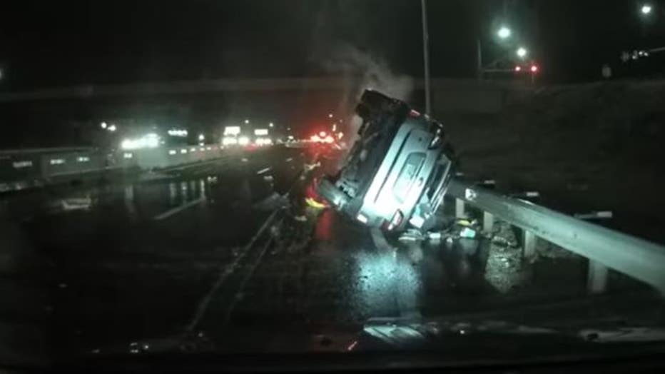 Video captured on dashcam shows crash into the water barrels in front of a concrete highway divider in Colorado. Credit: Jason Michael Bennett via Storyful.