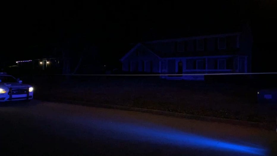 Police tape surround a Snellville home where two people were shot on Jan. 7, 2022.
