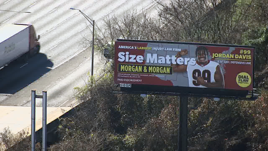 A digital billboard in metro Atlanta advertising the Morgan & Morgan law firm features UGA defensive lineman Jordan Davis ahead of the College Football National Championship Game.