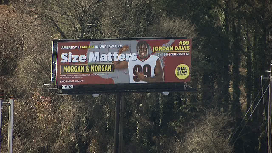 A digital billboard in metro Atlanta advertising the Morgan & Morgan law firm features UGA defensive lineman Jordan Davis ahead of the College Football National Championship Game.