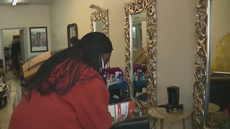 Business owner Isoken Okpuroukre packs up her salon and beauty supply store after receiving an eviction notice. She says she pays 2-3 months ahead in her rent.