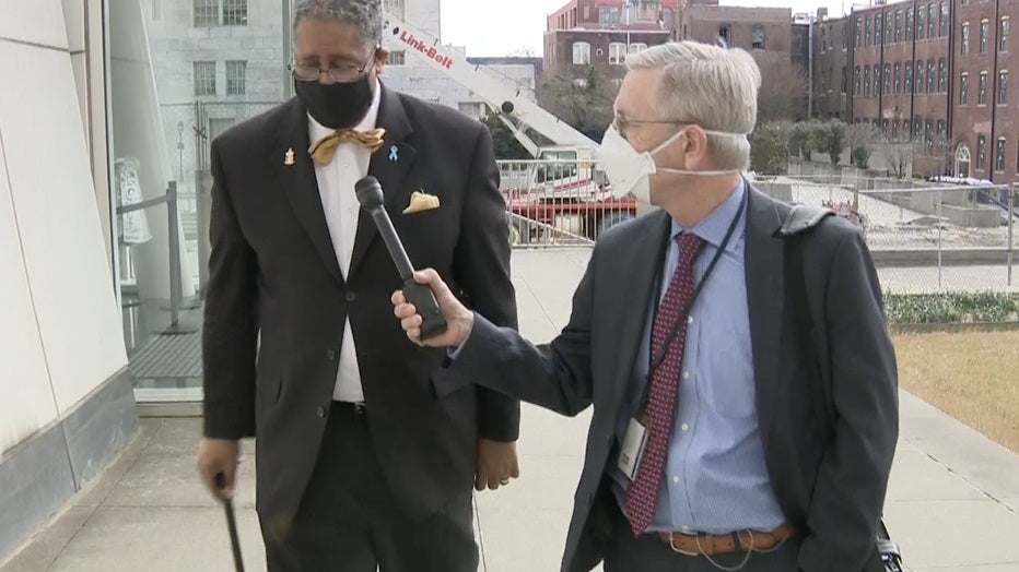 Former Stonecrest Mayor Jason Lary is met by FOX 5 I-Team Reporter Randy Travis as he walks into the federal courthouse in Atlanta to enter a guilty plea to stealing CARES Act money on Jan. 5, 2022.