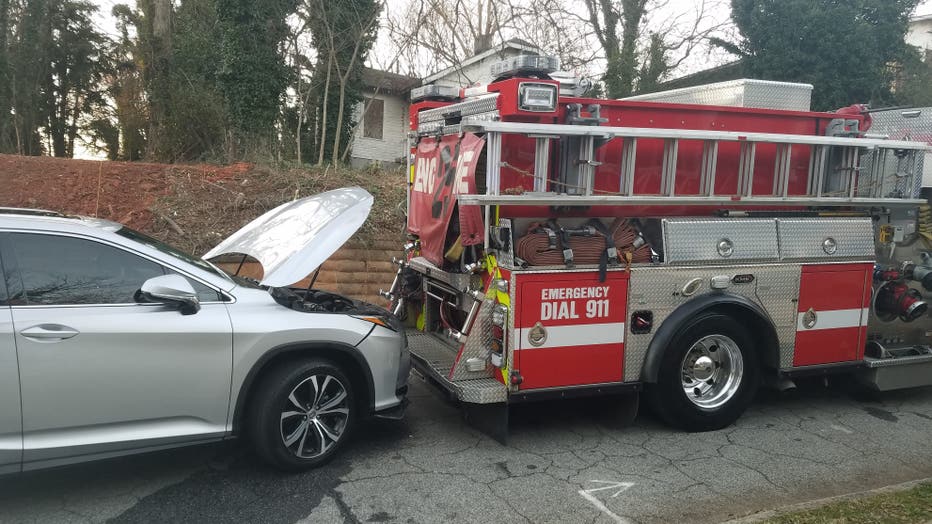 An Atlanta fire engine crashed into a parked car after officials say a homeless man disengaged the brake on Feb. 19, 2022.