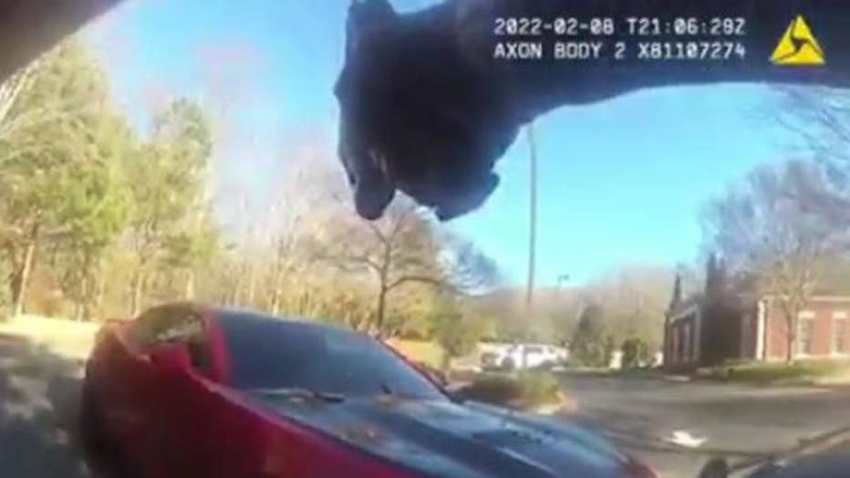 A Forsyth County deputy orders the driver of a Camaro wanted in connection to a car theft to put their hands out of the car after a brief pursuit on Feb. 8, 2022.