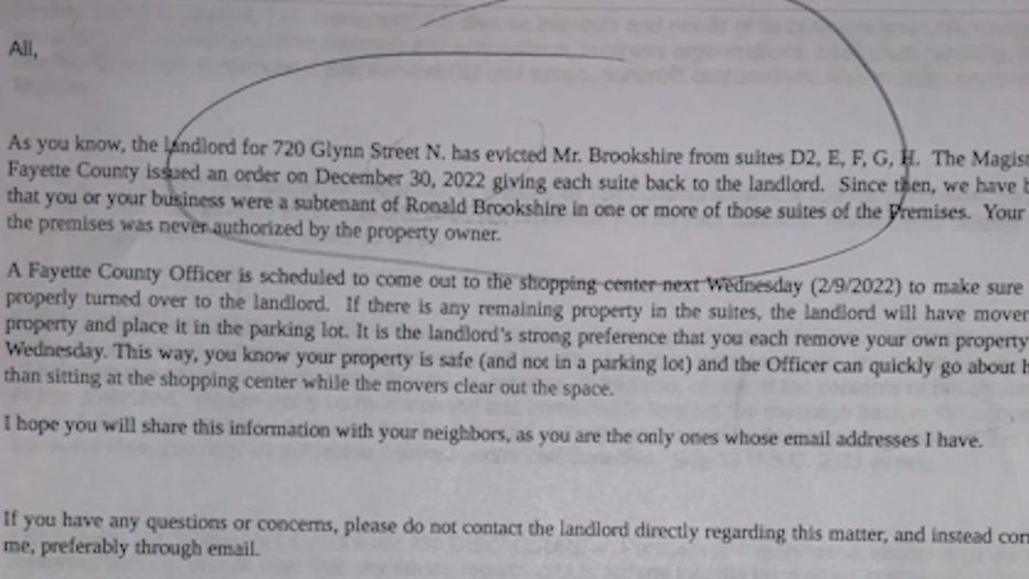 Business owners in one Fayetteville strip mall say they received eviction notices despite paying their rent.