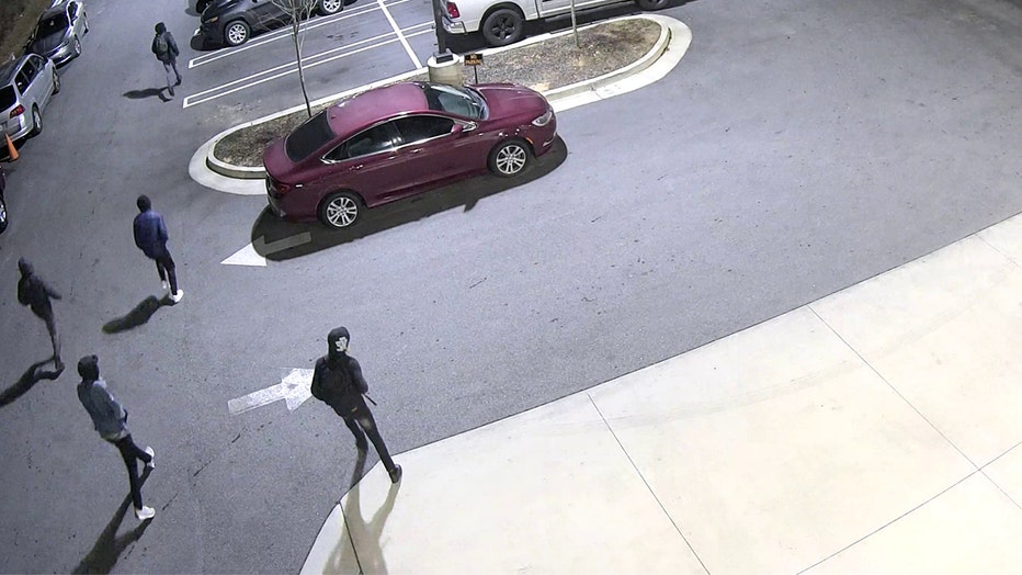 This surveillance image released by DeKalb County police shows suspects in the murder of a security guard on Feb. 19, 2022.