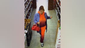 Woman caught on camera shoplifting from liquor store, police say