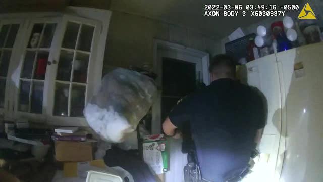 Cops break into burning home to save trapped man