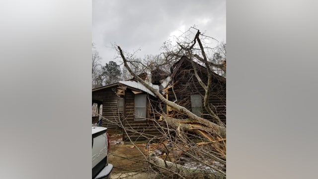 First responders rescue two people trapped after tree falls on Cherokee County home