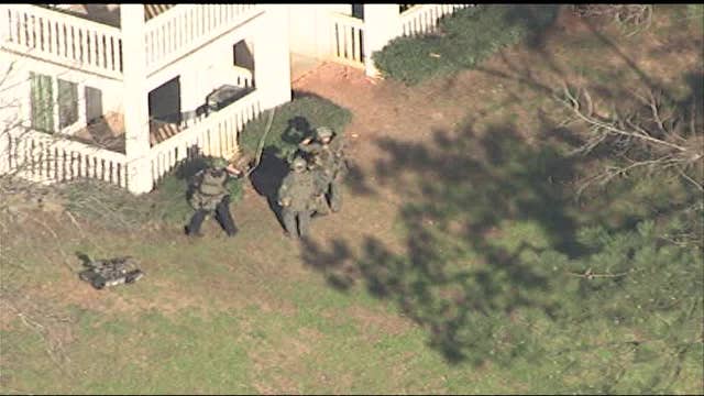 Officer, armed man running after woman exchange gunfire in DeKalb County
