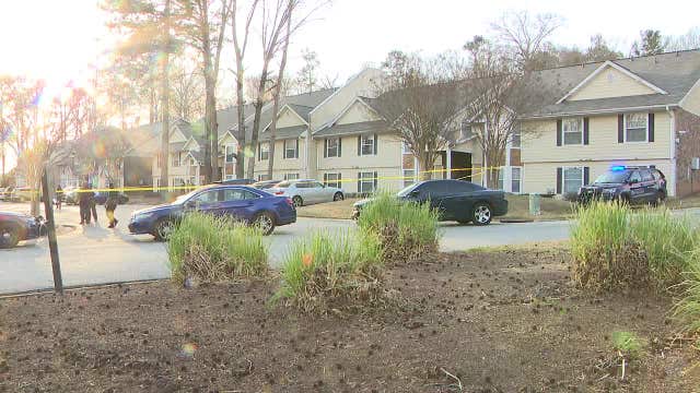 Teen bystander hit by stray bullet fired during parking lot fight, police say